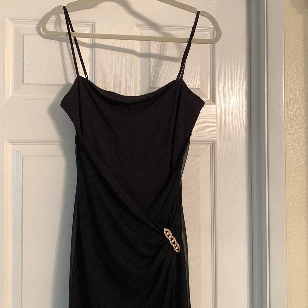 Black spaghetti strap jumpsuit with cover. Worn a few times, looks new!